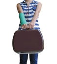 injured woman traveler broken arm in green cast standing and holding suitcase isolated on white background, clipping path included Royalty Free Stock Photo