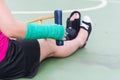 Injured woman wearing sportswear painful arm with gauze bandage Royalty Free Stock Photo