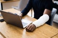 Injured Worker Compensation. Broken Arm African Man