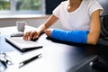 Injured Worker Compensation. Broken Arm African Woman Royalty Free Stock Photo