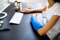 Injured Worker Compensation. Broken Arm African Woman Royalty Free Stock Photo