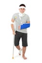 Injured young man on crutch