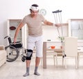 Injured young man doing exercises at home Royalty Free Stock Photo