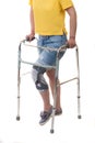 Injuried woman with walking frame and knee orthosis