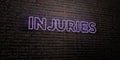 INJURIES -Realistic Neon Sign on Brick Wall background - 3D rendered royalty free stock image