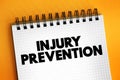 Injury Prevention text quote, concept on notepad Royalty Free Stock Photo