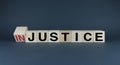 Injustice or justice. Cubes form the choice words Injustice or Justice