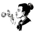 Pretty woman blowing soap bubbles