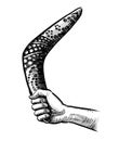 Hand with a boomerang Royalty Free Stock Photo