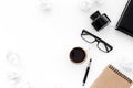 Ink, dip pen, notebook, coffee, glasses for writer workplace set on white office background top view mock-up Royalty Free Stock Photo