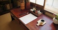 Ink, paint brush and Japanese art with paper on a desk in a home studio with creativity tools. Creative, painter Royalty Free Stock Photo