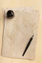 Ink pen, inkpot and old paper Royalty Free Stock Photo