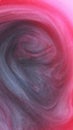 Ink smoke color swirl fluid red black pink dye mix Royalty Free Stock Photo