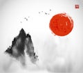 Ink wash painting with big red sun, flock of birds and high misty mountain peak on white background Traditional oriental