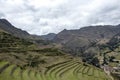 Inka ruins with Andens, stair-step like agricultural terrace dugs into the slope of a hillside in Pisac Archeological park, Peru