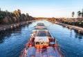 Inland vessel drives a canal Royalty Free Stock Photo