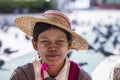 Portrait burmese girl a straw hat in local market. Inle lake, Myanmar, Burma