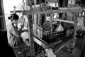 Inle Lake. Myanmar. 28/11/2014: Burmese woman weaves on a traditional silk loom Royalty Free Stock Photo