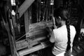 Inle Lake. Myanmar. 28/11/2014: Burmese young woman weaves on a traditional silk loom Royalty Free Stock Photo