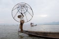 Inle Lake Myanmar 12/16/2015 Intha fisherman using traditional cone fishing net