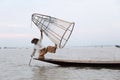 Inle Lake Myanmar 12/16/2015 Intha fisherman using traditional cone fishing net