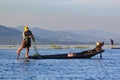 Inle Lake, Myanmar, November 20 2018 - Authentic fishermen working checking their nets on the waters of Inle Lake. Royalty Free Stock Photo