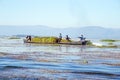 INLE LAKE, MYANMAR - NOVEMBER 23, 2015: Local workers collecting