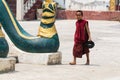 Inle, Myanmar - April 2019: Burmese monk walking in the monastery backyard