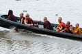 Inle, Myanmar - April 2019: Burmese monks having boat ride on Inle lake Royalty Free Stock Photo