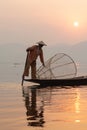 Inle, Myanmar - March 2019: Traditional Burmese leg rowing fisherman at Inle lake Royalty Free Stock Photo