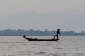 Inle, Myanmar - March 2019: Traditional Burmese leg rowing fisherman at Inle lake Royalty Free Stock Photo