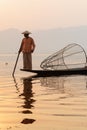 Inle, Myanmar - March 2019: Traditional Burmese leg rowing fisherman at Inle lake Royalty Free Stock Photo