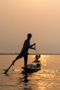 Inle, Myanmar - March 2019: Traditional Burmese leg rowing fisherman at Inle lake Royalty Free Stock Photo