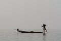 Inle, Myanmar - March 2019: Traditional Burmese leg rowing fisherman at Inle lake Royalty Free Stock Photo