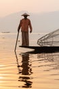 Inle, Myanmar - March 2019: Traditional Burmese leg rowing fisherman at Inle lake Royalty Free Stock Photo