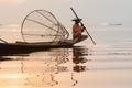 Inle, Myanmar - March 2019: Traditional Burmese leg rowing fisherman at Inle lake Royalty Free Stock Photo