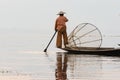 Inle, Myanmar - March 2019: Traditional Burmese leg rowing fisherman at Inle lake Royalty Free Stock Photo