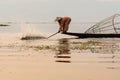 Inle, Myanmar - March 2019: Traditional Burmese leg rowing fisherman at Inle lake Royalty Free Stock Photo