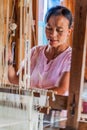 INLE, MYANMAR - NOVEMBER 28, 2016: Worker in Myat Pwint Chel weaving workshop Inn Paw Khone village at Inle lake, Myanm Royalty Free Stock Photo