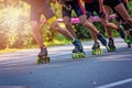 Inline roller skaters racing in the park o