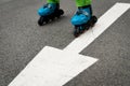 Inline skating arrow asphalt road Royalty Free Stock Photo