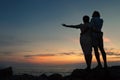 Inlove couple on the seacoast at sunset time Royalty Free Stock Photo