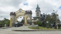 Car crossing the Bolivar bridge over the Malacatos river next to the monument The city gate, built in 1998