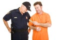 Inmate Bribes Police Officer Royalty Free Stock Photo