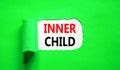 Inner child symbol. Concept words Inner child on beautiful white paper. Beautiful green table green background. Psychological, Royalty Free Stock Photo
