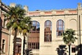 Inner corner, with palm trees of the courtyard, of a historic building hosting a faculty of the University of Padua.