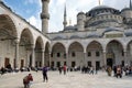 Inner courtyard of the Blue Mosque in Istanbul. Visitors, tourists and believers