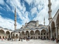 Inner courtyard of the Blue Mosque in Istanbul. Visitors, tourists and believers