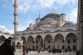 Inner courtyard of the Blue Mosque in Istanbul. Visitors, tourists and believers