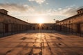 Inner courtyard of a prison with a sky with clouds and evening light